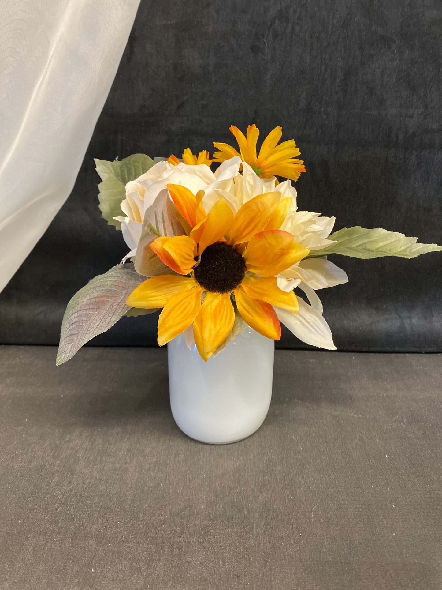 Faux Flowers In Glass Jar